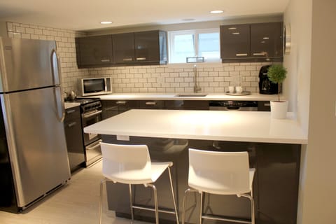 Full kitchen and breakfast bar. Dishes, pots and pans, utensils, linens all included.