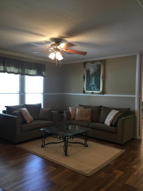 Living room. Linoleum throughout. No carpet to catch the sand. Great A/C & heat.