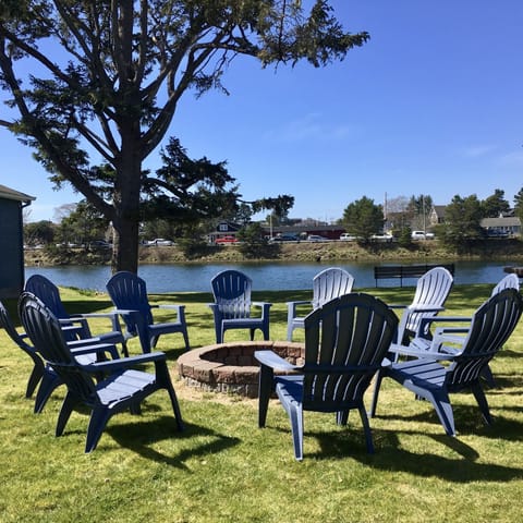 Backyard Fire Ring With Large Yard To The River's Edge