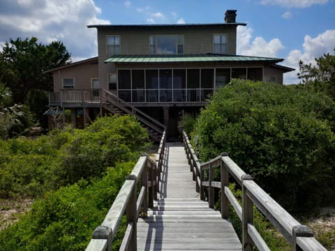 View of screened-in porch and our private walkway to the beach