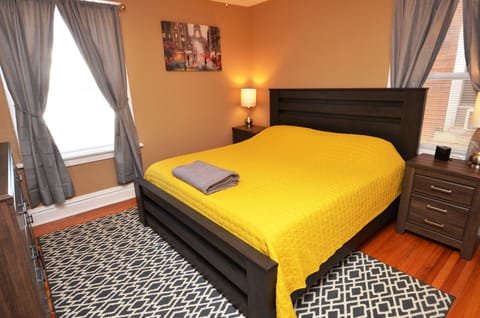 Bedroom With King Sized Bed And 24" Vizio Smart TV