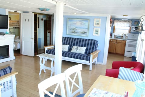 view from dining area looking into the living area and kitchen 