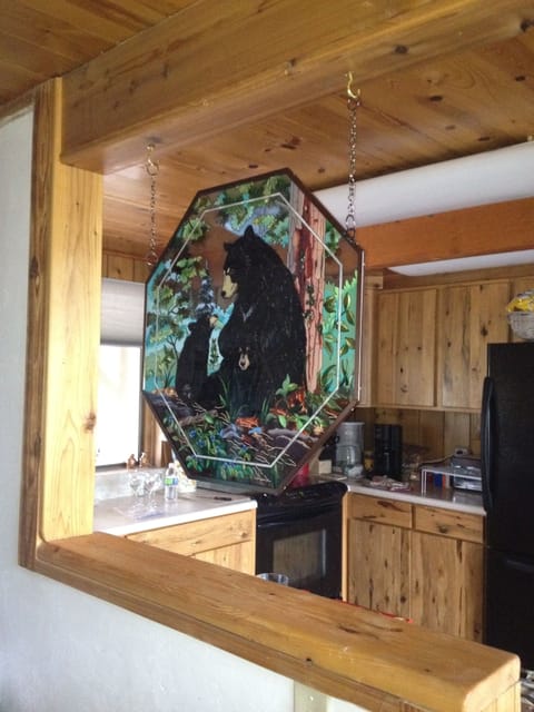 Bear family stain glass picture to greet guests as they view kitchen area.
