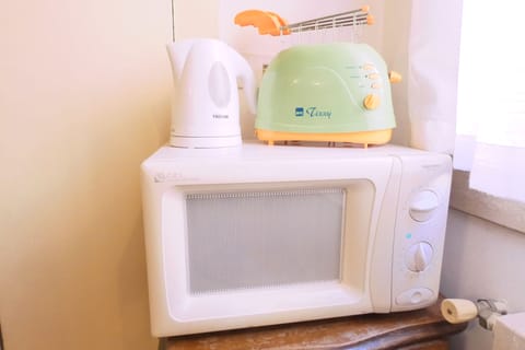 Kitchen equipment: microwave oven, toaster and electric kettle