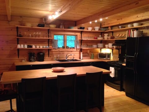 Fully-equipped kitchen is open to the dining and living areas.