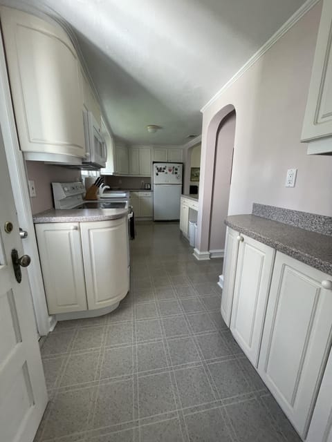 Another view of the kitchen with extra countertops and storage