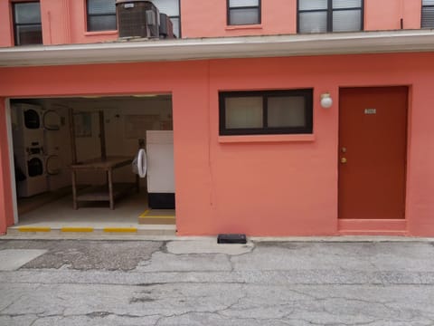 Rear entrance w/ next door laundry