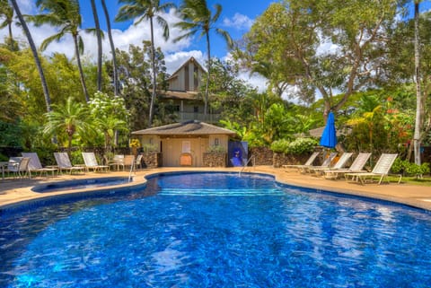 Sparkling blue pool with change rooms. (no hot tub)