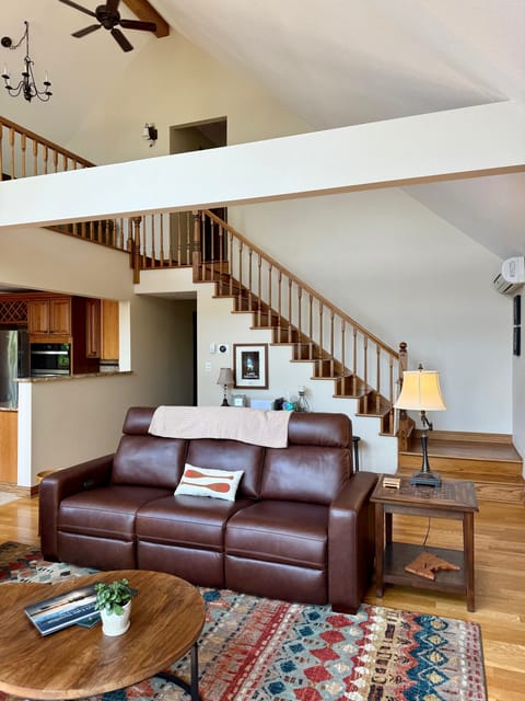 Stairs to loft and 2 upper bedrooms & bath.  Main lvl hall to half bath & Master