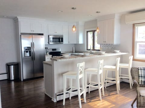 Open Concept Kitchen Overlooks Living Room