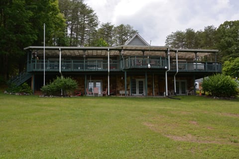 Rear of House with 2 Covered Porches Facing Lake, Beaches, Gazebo, and Boathouse