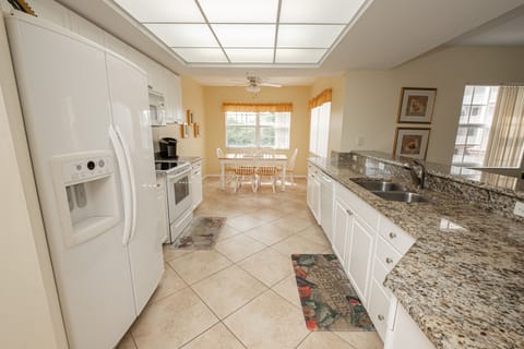 Large kitchen with granite countertops