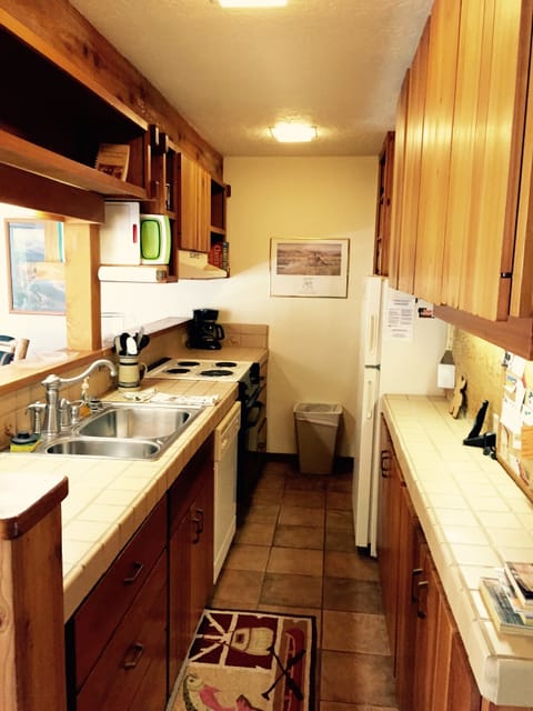 Fully stocked kitchen with new custom tile work.