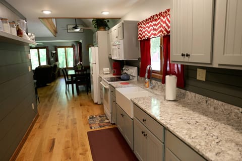 Granite counter top with under mounted farm sink.