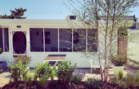 Classic beach cottage with screened front porch and 