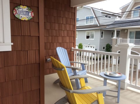 Enjoy the ocean breeze from the wrap-around porch at the top of the entry stairs