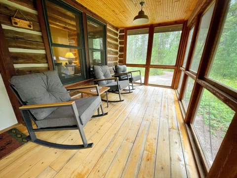 One side of screened-in front porch. Perfect for bug-free entertaining. 