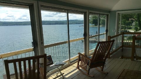 Enjoy a morning cup of coffee from the comfort of the sleeping porch.