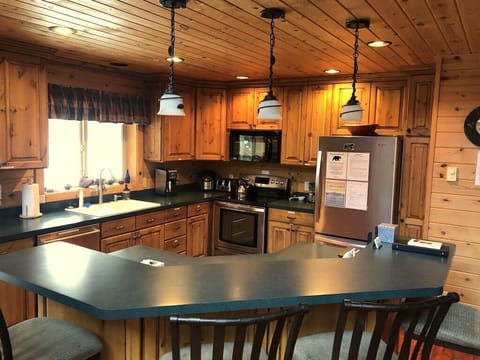 Another view of the kitchen. Extra seating at the breakfast bar.