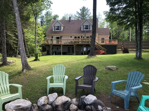 View of the  house from fire pit and lake