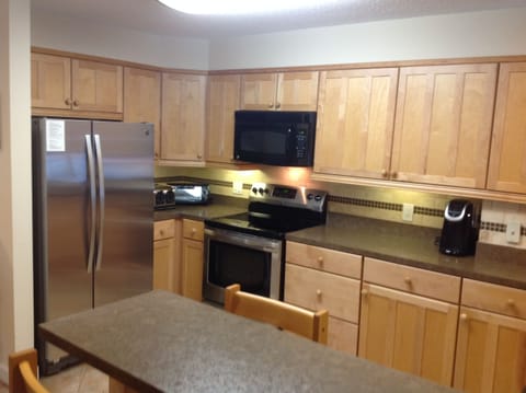 Kitchen with bar top seating for 4