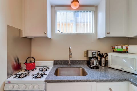 Small kitchen for cooking meals.