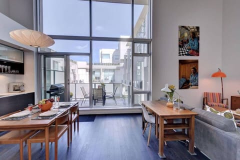 Floor to Ceiling Windows in this historic 2 bedroom 2 bath loft! 