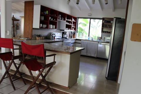 Open plan kitchen with counter/bar with stools