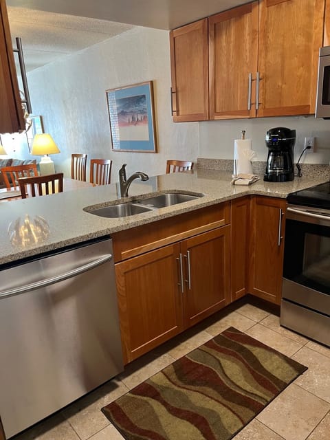 Kitchen showing dining table over the counter