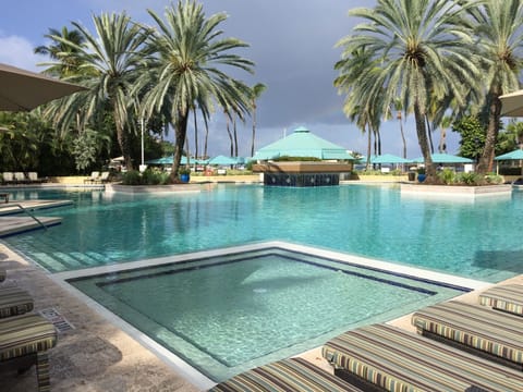 Relax around the quarter acre pool at the heart of the resort