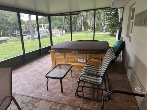 Screen porch with 6 person spa. Installed November, 2023.