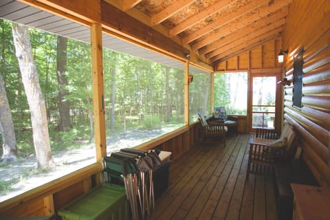 Screened porch with view of the lake & woods