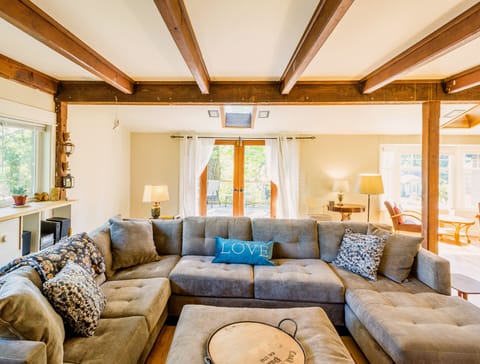 Welcoming living room- sectional couch, french doors to large deck
