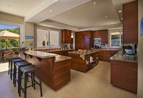 The open, well-ordered kitchen has plenty of space for cooking, or congregating.