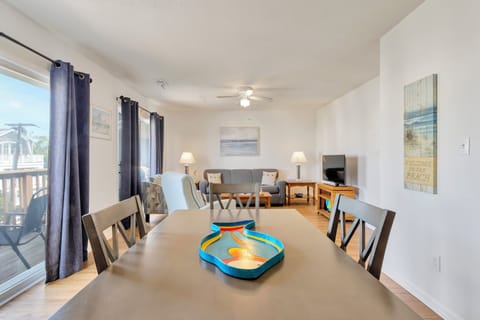 Open living area with dining table for 4 and great views from balcony sliders