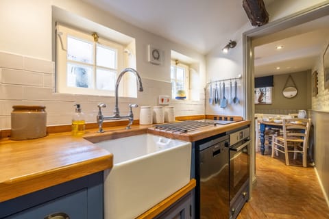 Yew Tree Cottage, Blakeney: Well-equipped kitchen leading to dining area