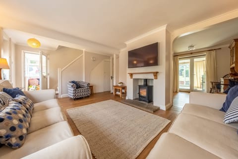 Winchelsea, Brancaster: Sitting room with wood burning stove
