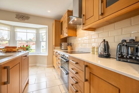 Ground floor: The kitchen overlooks the front garden ...
