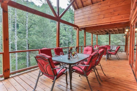 Main Porch has comfortable seating for 16 people. 2 tables, recliners, fireplace
