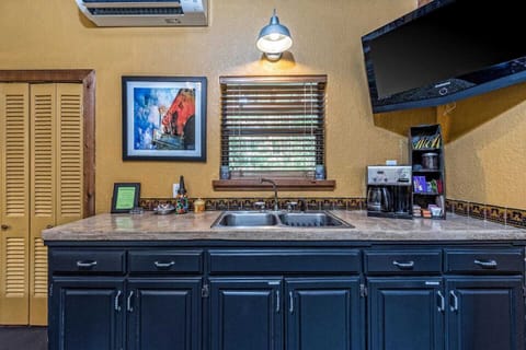 Sink, Coffee Pot with Coffee provided, toaster oven  fridge/freezer and microwave