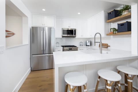 Another view of your kitchen and bar area. This condo is perfect for your family
