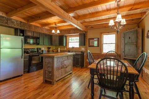 Poplar bark siding on kitchen island and soffit. Well equipped kitchen for cooks