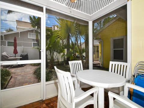 Screened in patio looks into the courtyard.