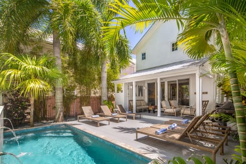 Lovely heated pool with tropical surroundings