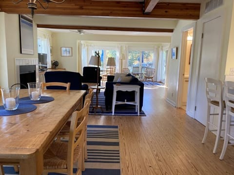 Open kitchen, dining, living room, and game spaces.