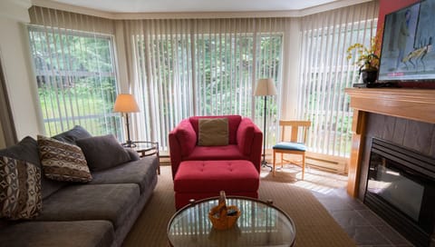 Cozy living room with view of woods