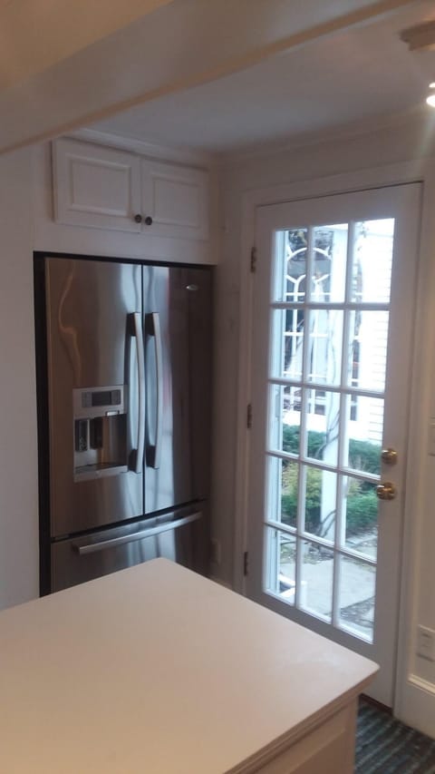 Kitchen door, leading to the garden, carriage house and patio