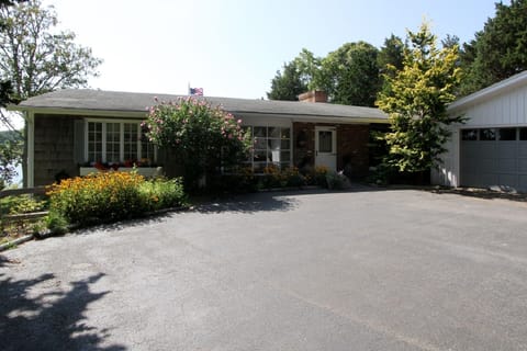 Front view of house with long private driveway