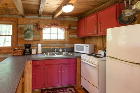 Fridge, oven/range, microwave, coffee maker, toaster, modest cooking supplies.