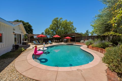 Beautiful outdoor space with solar thermal heated pool, views, lounges, and bbq!